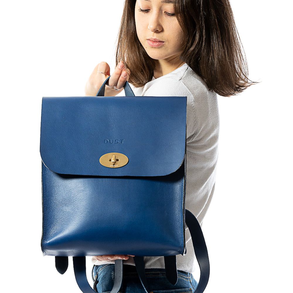 
                      
                        Leather Backpack in Cuoio Blue Artist Collection
                      
                    