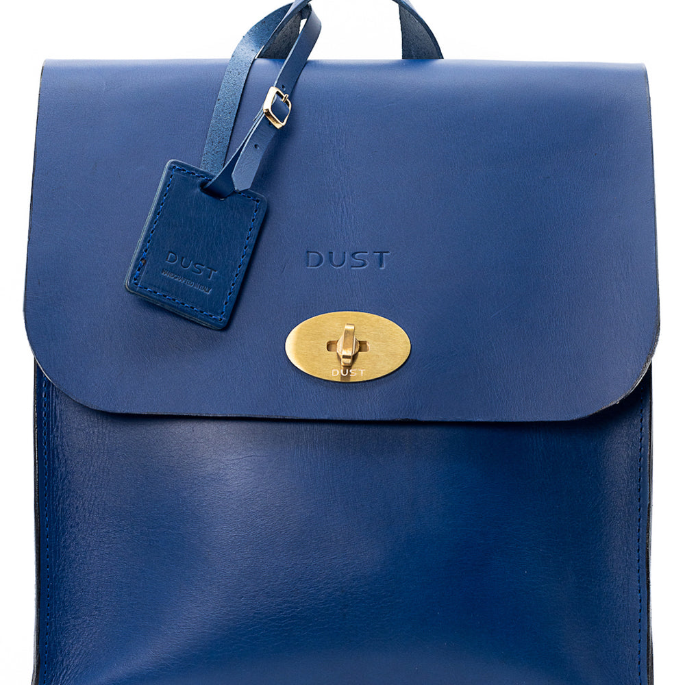 
                      
                        Leather Backpack in Cuoio Blue Artist Collection
                      
                    