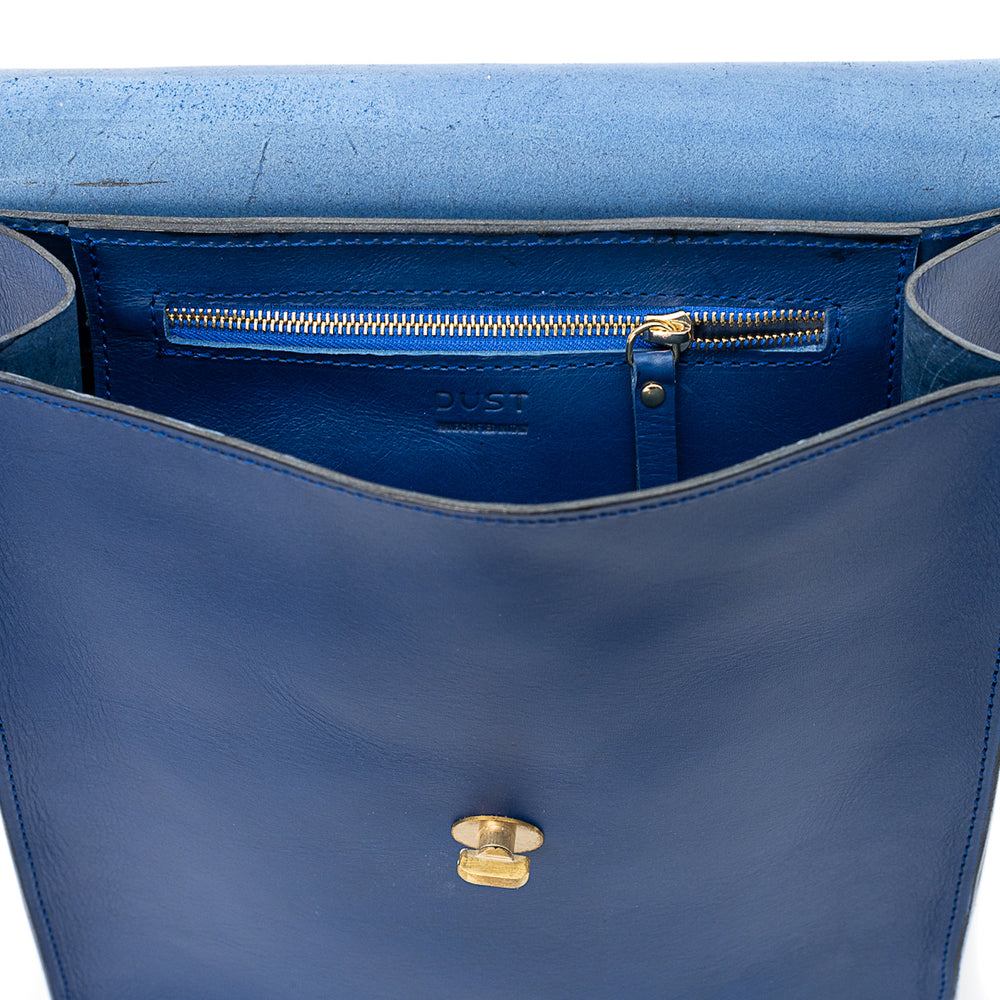 
                      
                        Leather Backpack in Cuoio Blue Artist Collection
                      
                    