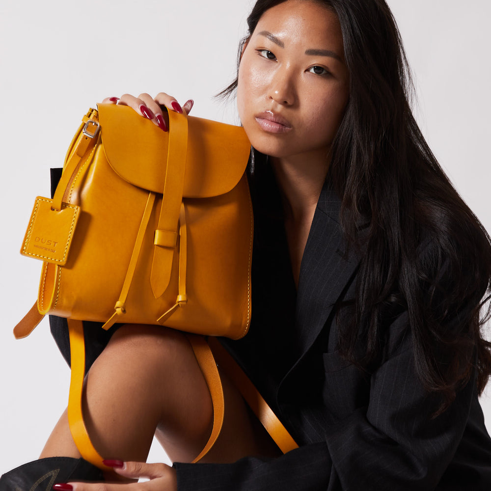 
                      
                        Leather Backpack in Cuoio Yellow Mod 130
                      
                    