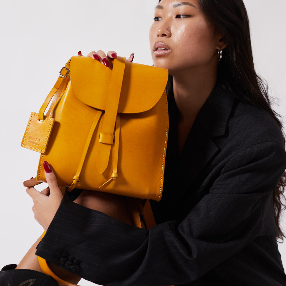 
                      
                        Leather Backpack in Cuoio Yellow Mod 130
                      
                    