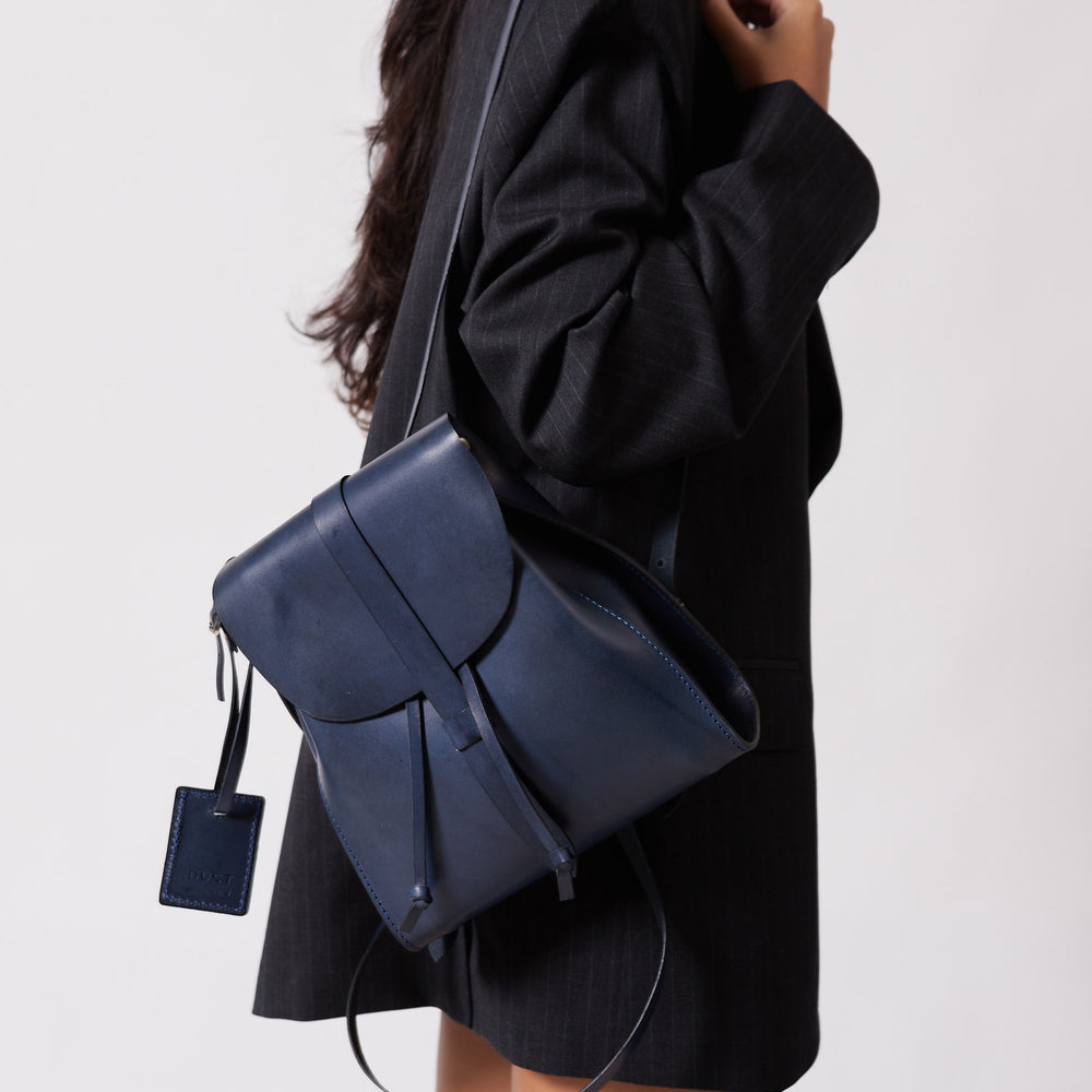 
                      
                        Leather Backpack in Cuoio Blue Mod 130
                      
                    